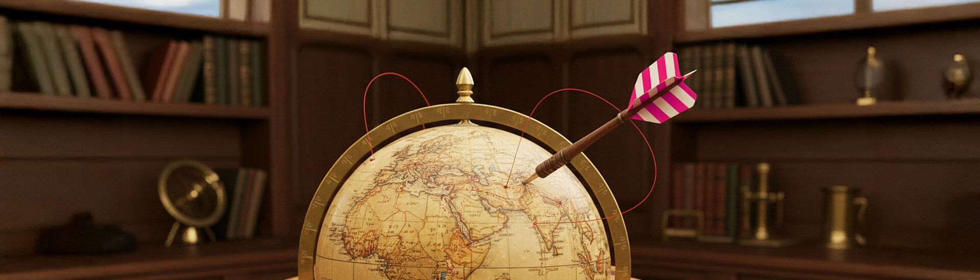 Globus in einer Bibliothek in dem ein Dartpfeil steckt 